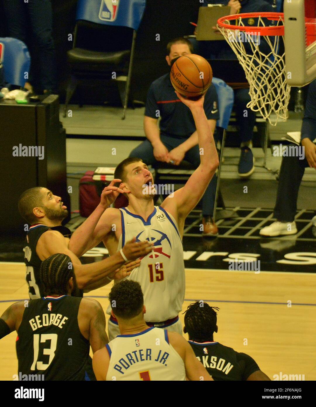 Los Angeles, United States. 01st Apr, 2021. Denver Nuggets' center Nikola Jokic scores on Los Angeles Clippers' defenders during the first half at Staples Center in Los Angeles on Thursday, April 1, 2021. The Nuggets defeated the Clippers 101-94. Photo by Jim Ruymen/UPI Credit: UPI/Alamy Live News Stock Photo