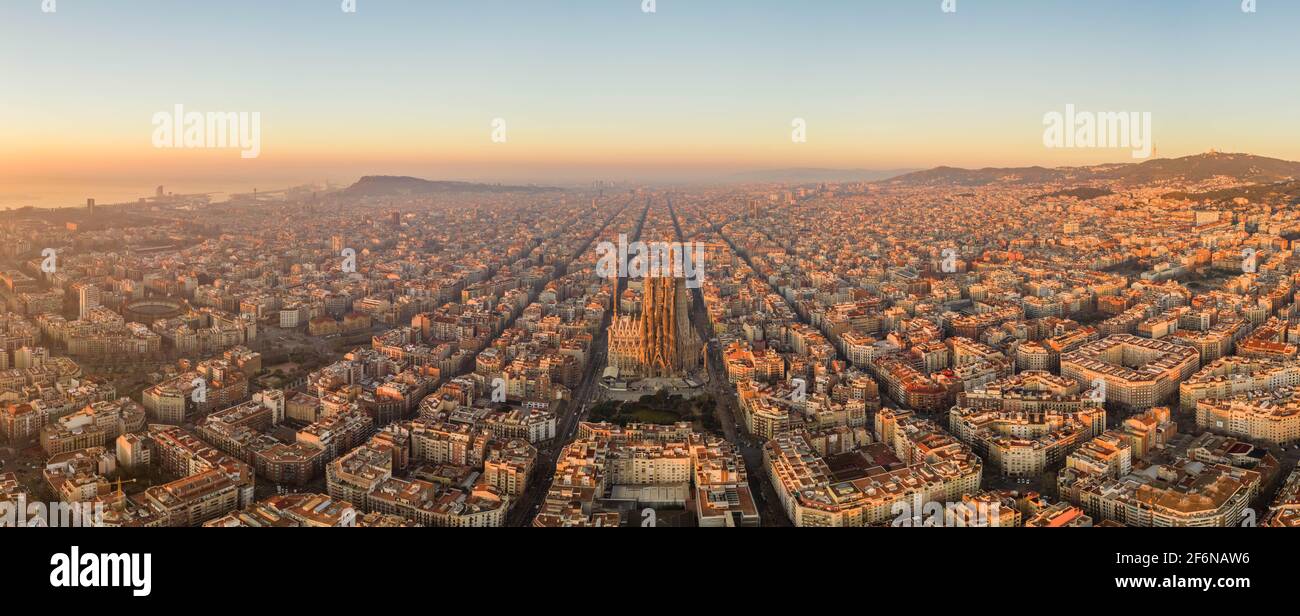 Aerial panorama drone shot of Barcelona city church in construction in sunrise hour in Spain winter Stock Photo