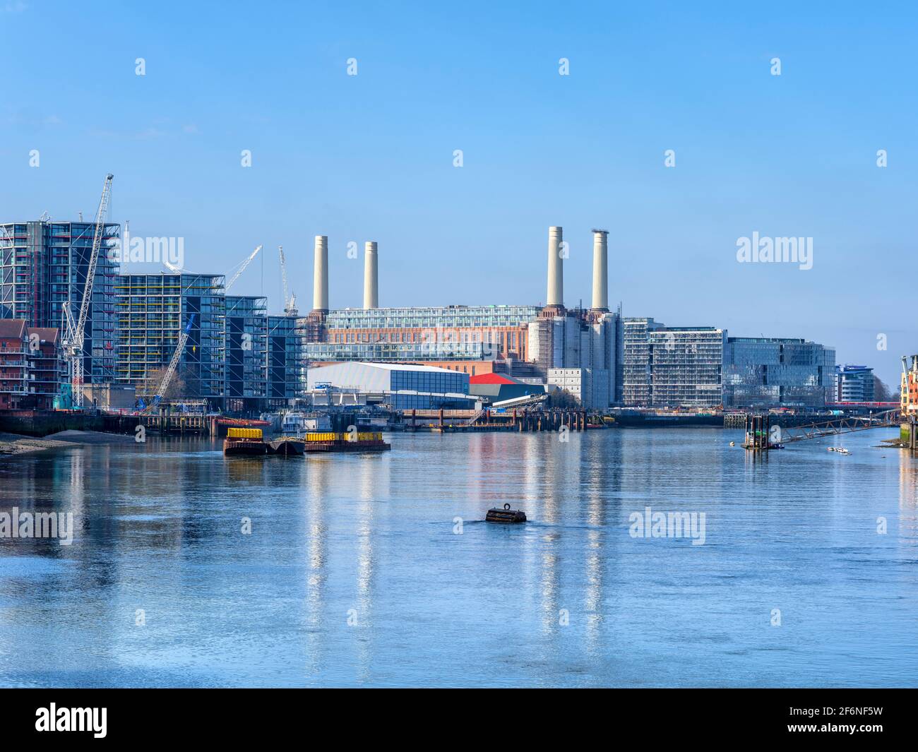 The view west from Vauxhall Bridge towards Battersea with the restored power station and new high rise apartment block lining the south bank. Stock Photo
