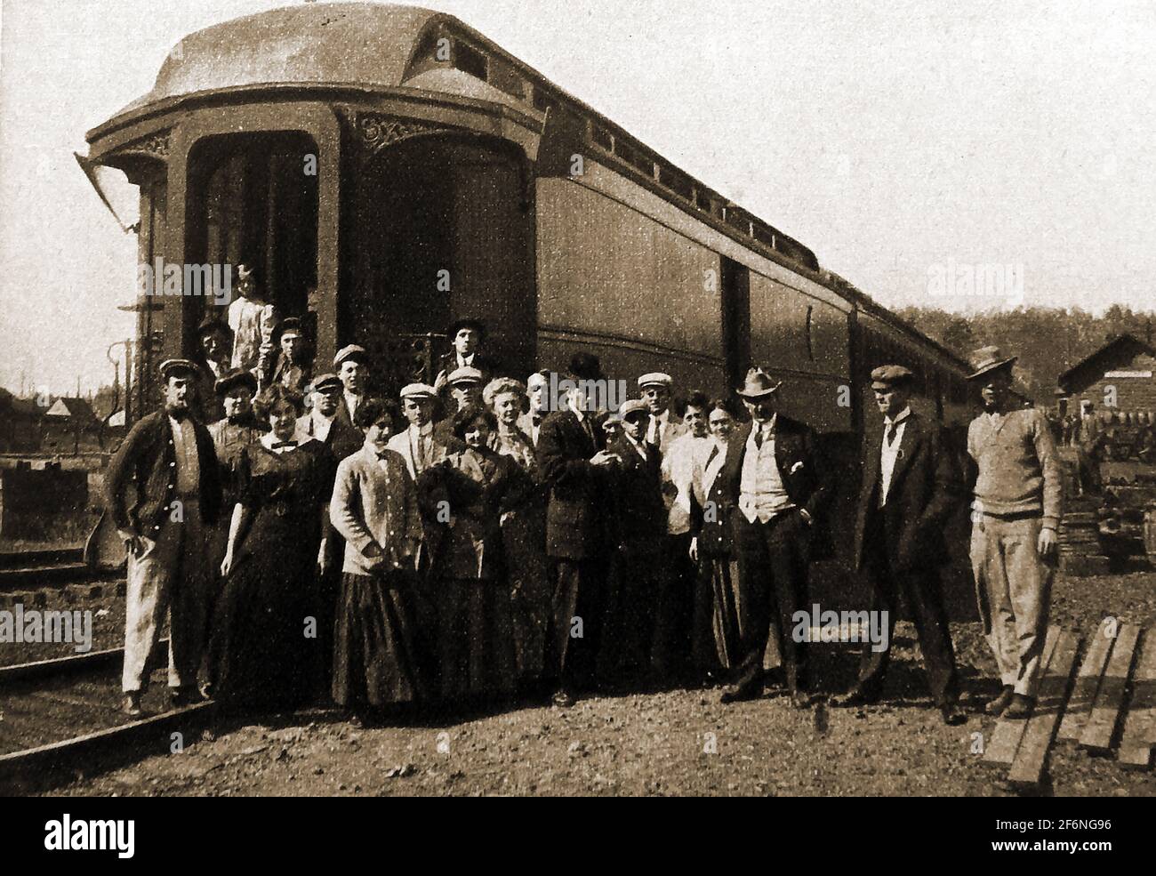 1914 - A moment in the early USA movie industry, This old Amercan photo shows the  Essanay Stock Company railway car used to transport film actors (shown) and props to various locations in the USA. The Essanay Film Manufacturing Company  motion picture studio  was founded in 1907  in Chicago, with a  film lot in Niles Canyon, California. Best known for Charlie Chaplin comedy  films and others that featured  Gloria Swanson, Francis X. Bushman, and studio co-owner  Broncho Billy Anderson. It later merged with other companies that were eventually absorbed by Warner Brothers. Stock Photo