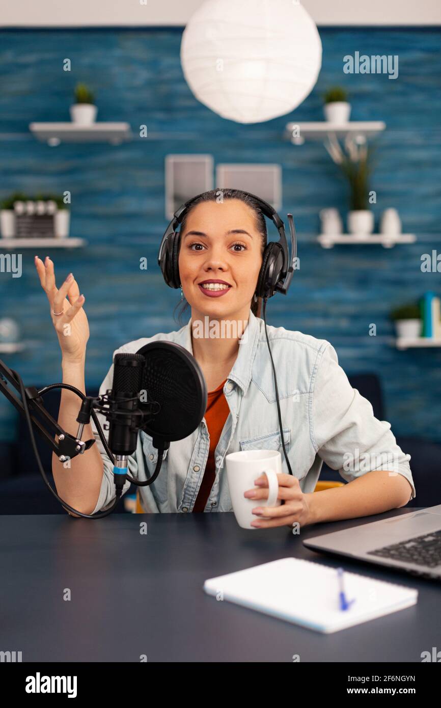 Content creator looking at camera while talking into microphone during  beauty podcast. Creative online show On-air production internet broadcast  host streaming live video, recording digital social Stock Photo - Alamy