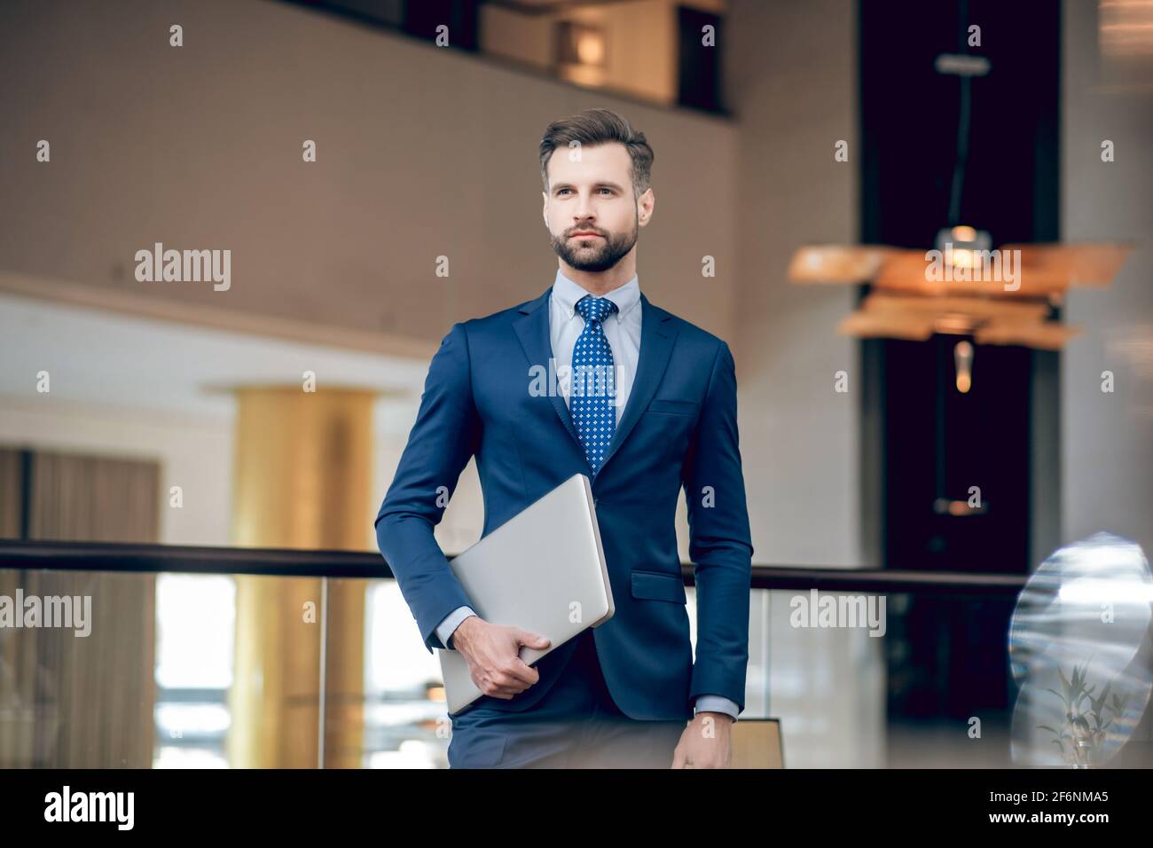 Businessman. Elegant businessman in a nice suit in the office Stock ...