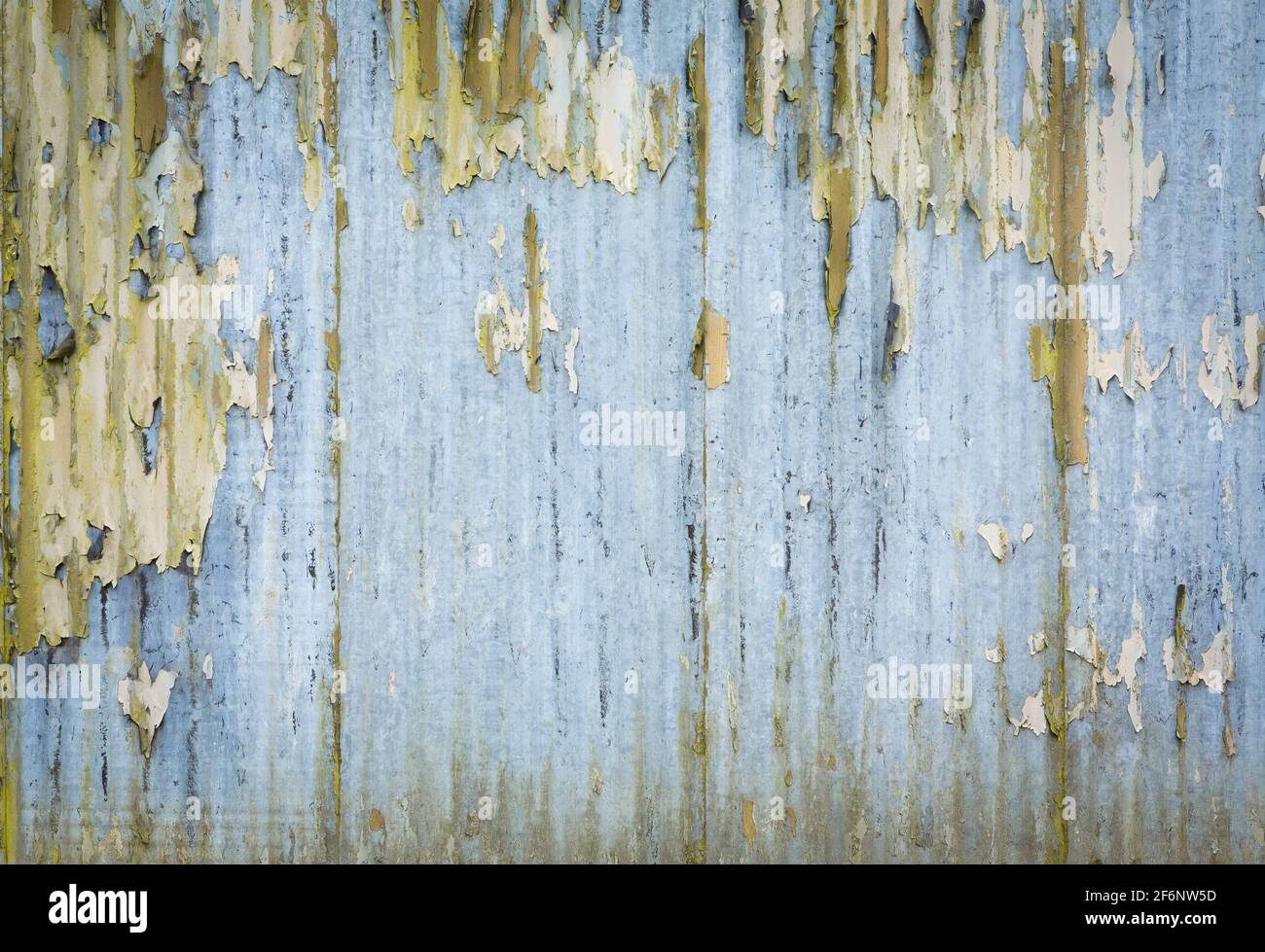 Corrugated iron pattern, texture or background. Rusty grunge style with weathered, distressed paint, UK Stock Photo