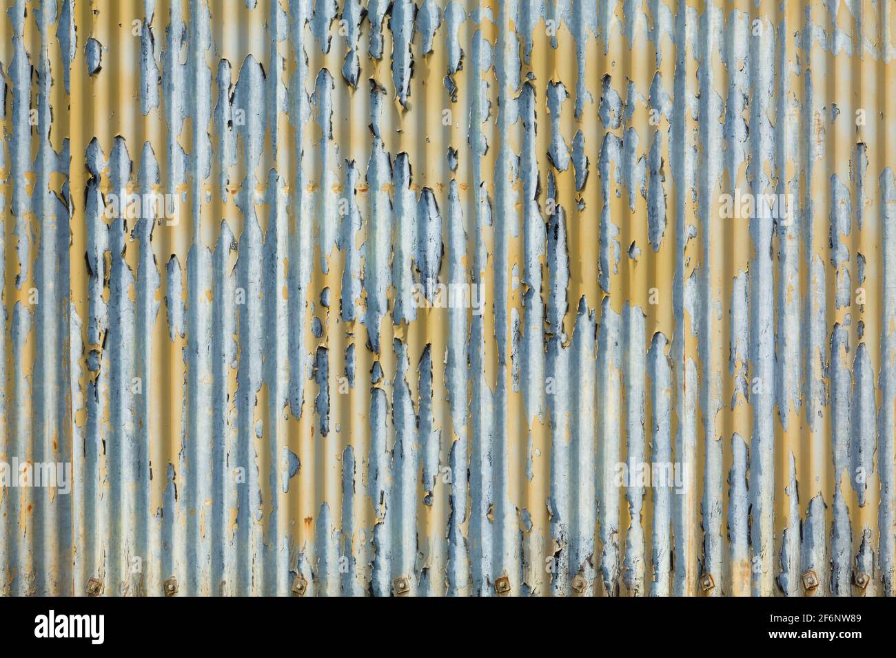 Corrugated metal roof with peeling paint, urban texture, pattern or background, UK Stock Photo