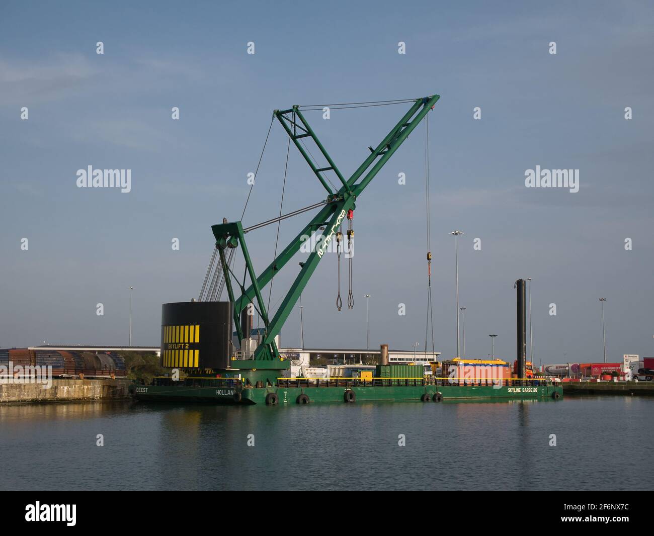 The 250 tonne crane Skylift 2 operating on the submersible Skyline Barge 26 while lifting equipment at docks in Alfred Dock, Birkenhead on the River M Stock Photo