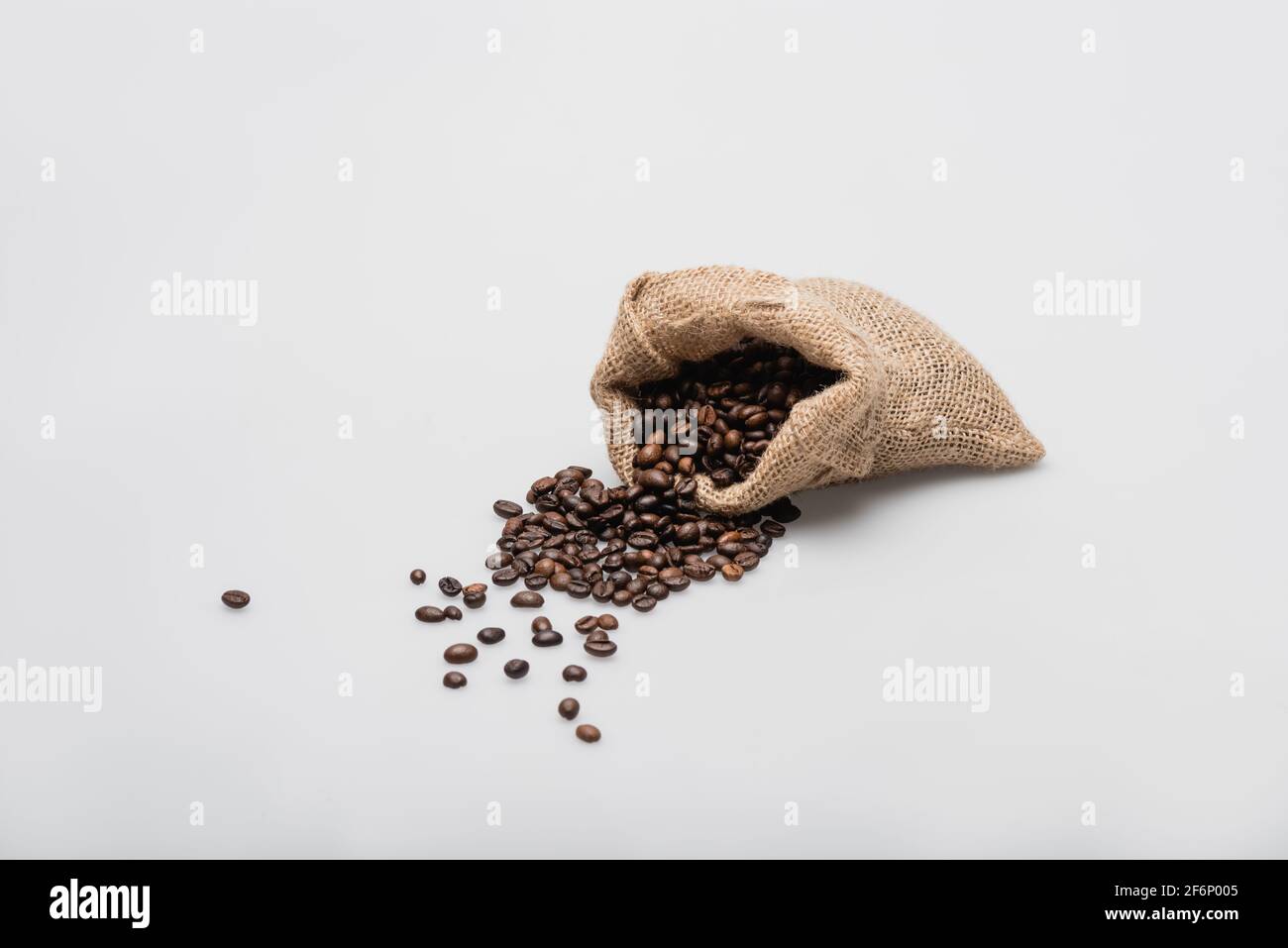 hessian sack bag with roasted coffee beans on white Stock Photo - Alamy