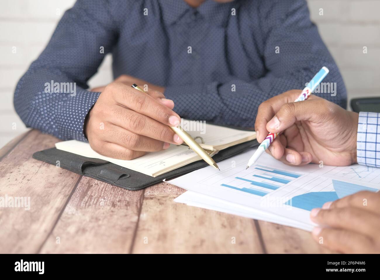 young people analyzing financial data on office desk  Stock Photo