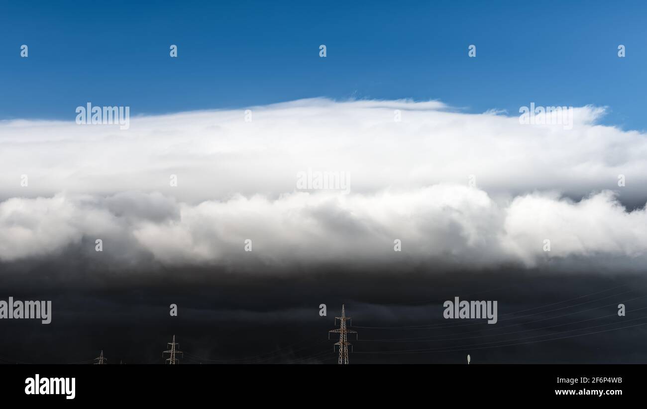 Sky with clouds and a dark thundercloud is approaching storm Stock Photo