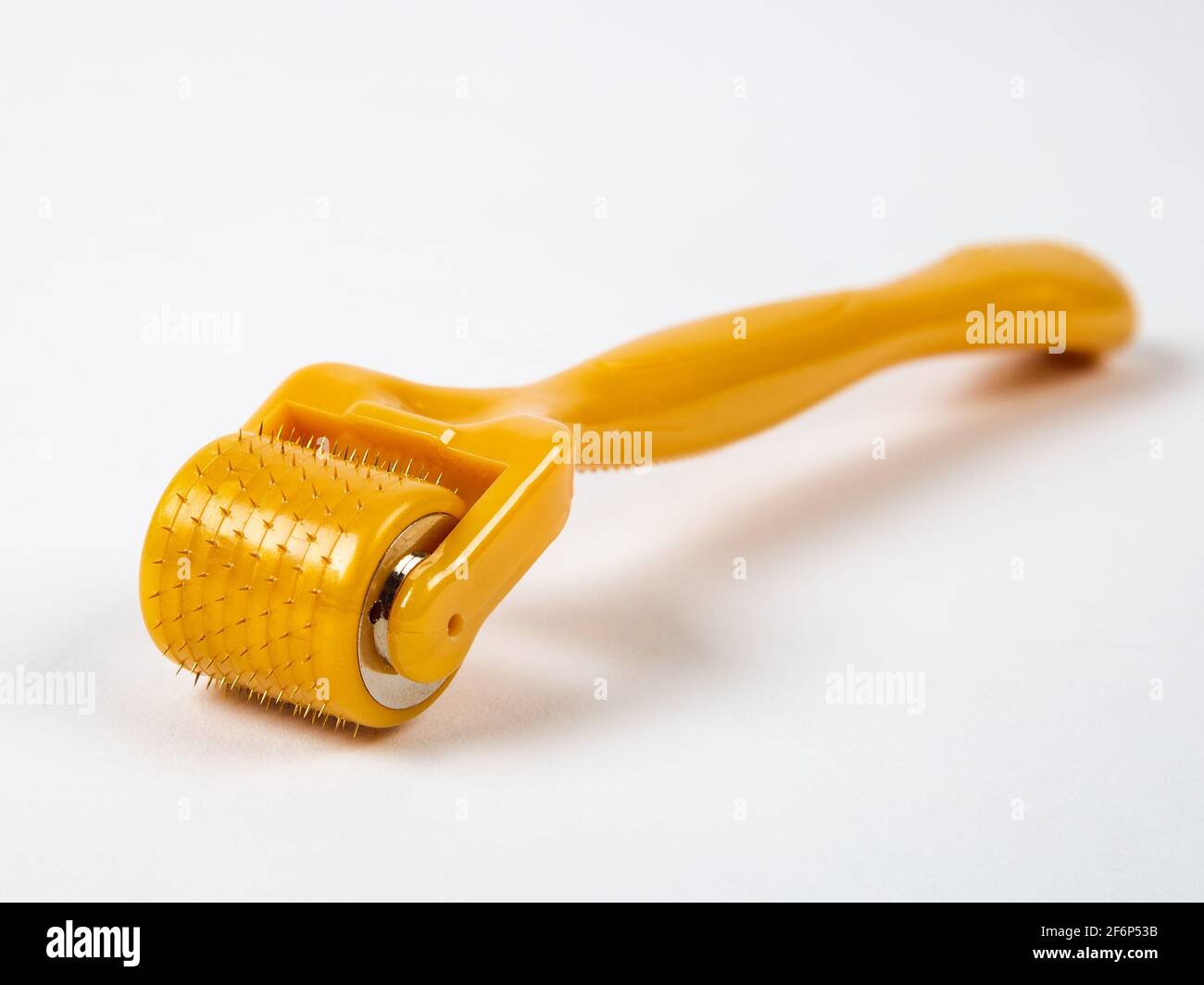 Mesoroller for the face on a white background. A tool for skin rejuvenation. Stock Photo