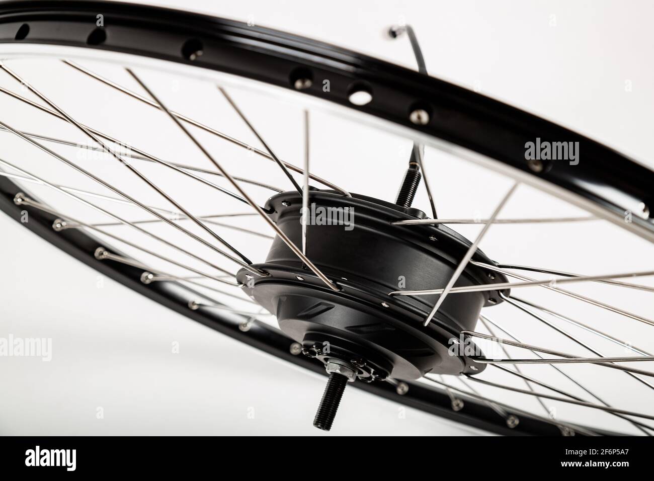 Electric motor on a bicycle wheel. White background Stock Photo Alamy