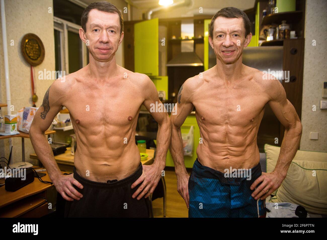 Ukraine (Dnepr) twin bros Alex and Yury Yarmolenko (11 June 1970), kickboxing European champs and coaches here both 50 years old posing like Bruce Lee Stock Photo