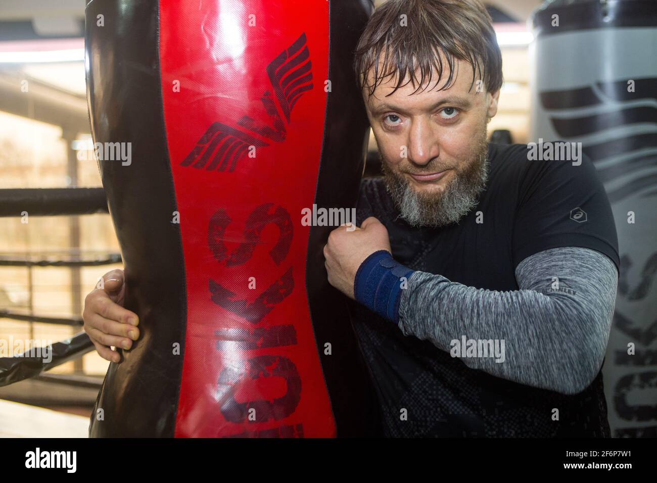 Healthy strong middle age middleweight businessman in wet from sweat