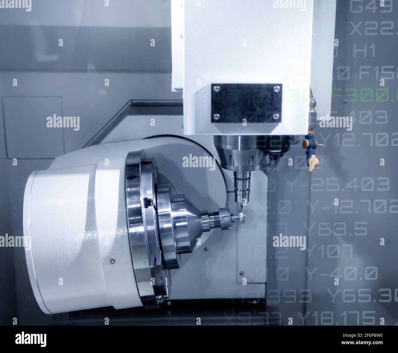 CNC milling or turning machine cutting bevel gear with milling spindle