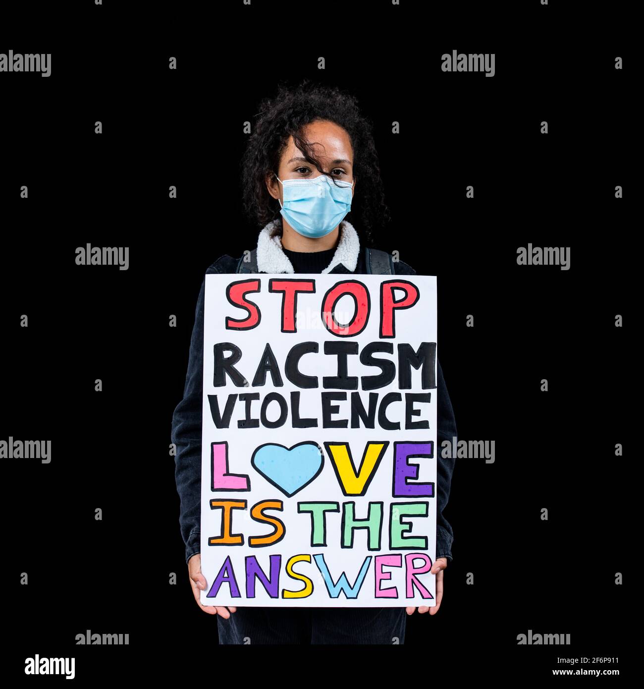 Girl holding up a placard hi-res stock photography and images - Alamy