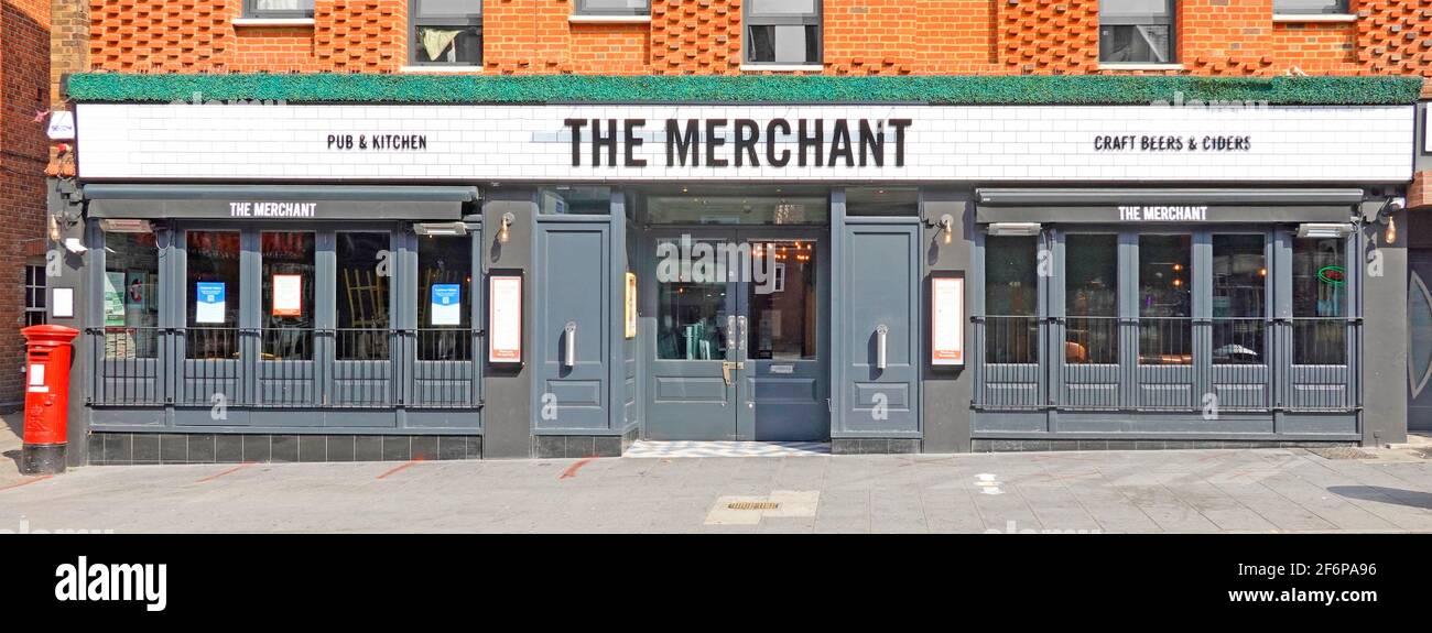 New long low modern frontage of The Merchant High Street pub building operated by Stonegate Group below office redevelopment site Brentwood Essex UK Stock Photo