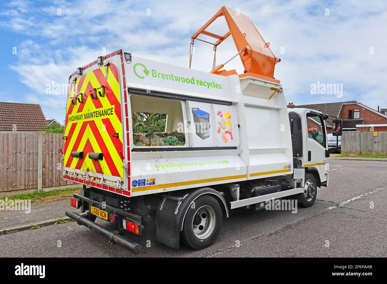 Brentwood Council recycling food waste management & collection dustcart lorry truck with hydraulic lift for recycle wheelie bin caddy bag emptying UK Stock Photo