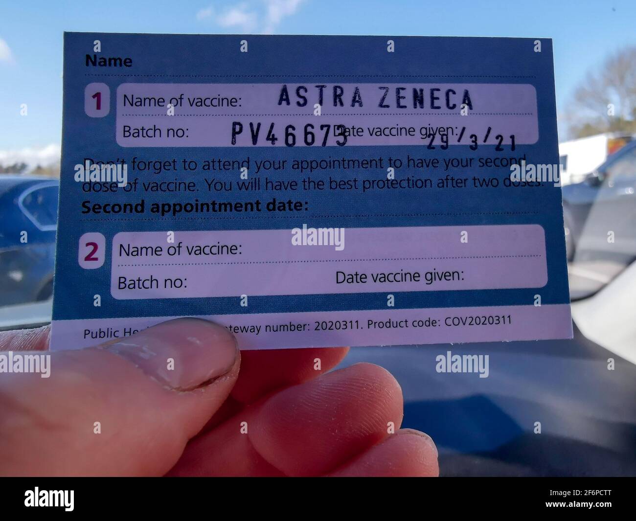 Close up of the Astra Zeneca Vaccination Card issued by the NHS in the UK. Stock Photo