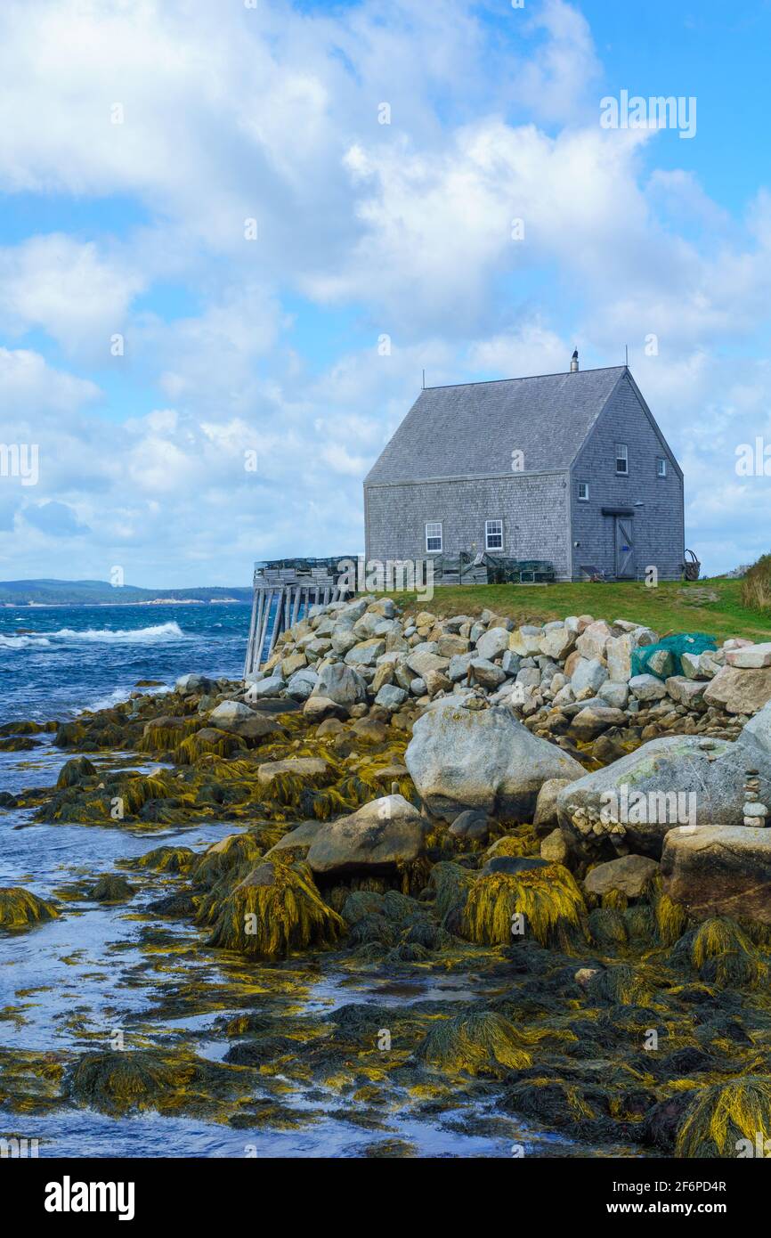 View of rocky shore and waterfront houses in the fishing village Indian