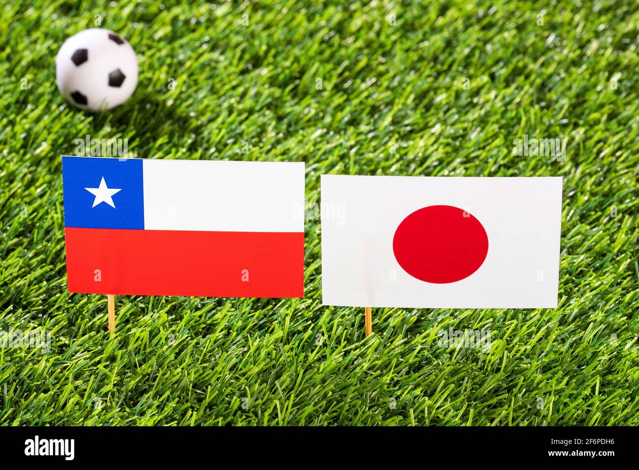 Flag of Chile and Japan in the football stadium - Cup America football match conmebol Brazil 2019. Stock Photo