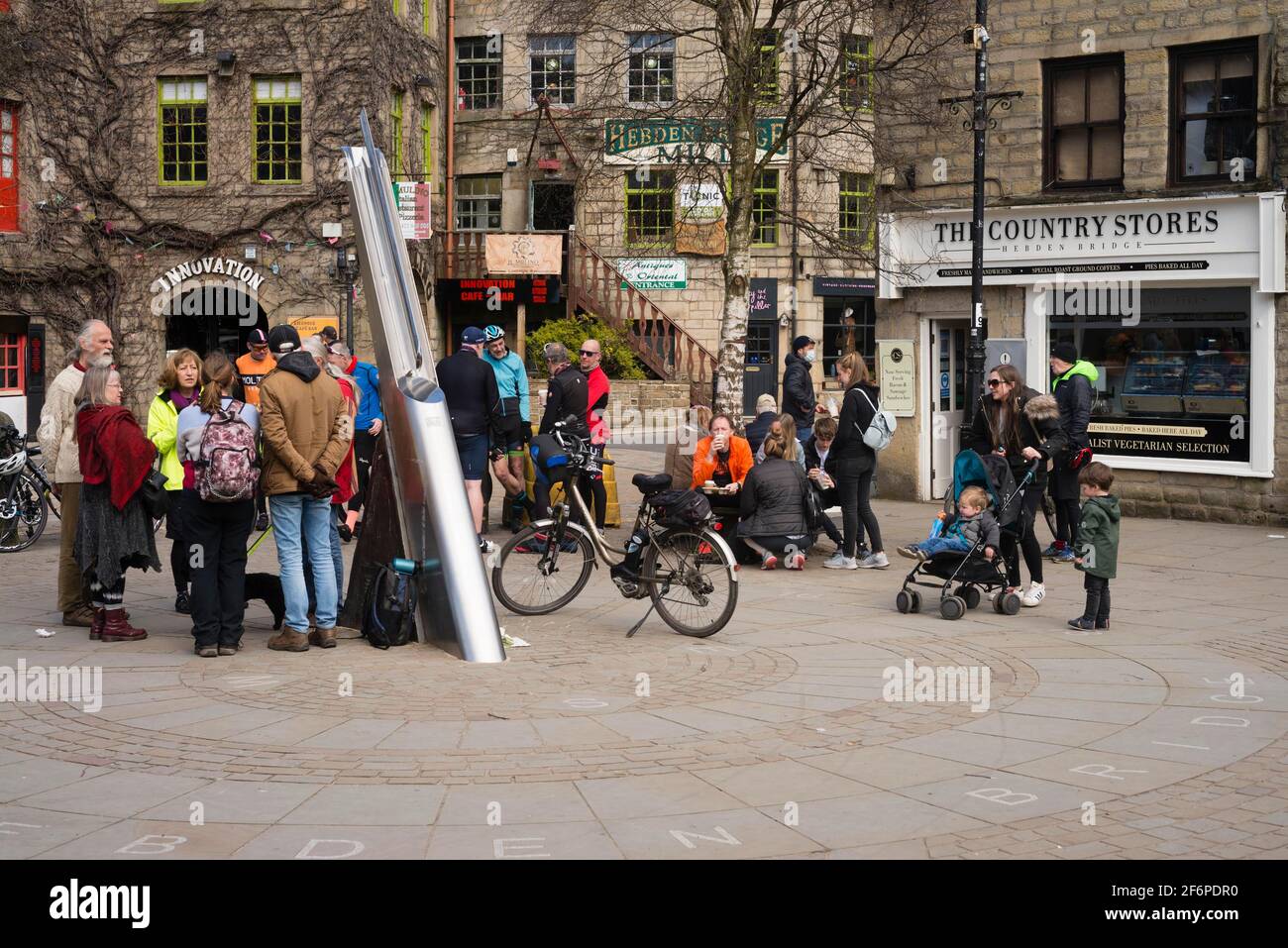 Hebden Bridge, Yorkshire, UK. 2nd Apr 2021. Crowds of people enjoying the good weather in the streets of Hebden Bridge, in West Yorkshire on Good Friday. Relaxation of Covid-19 restrictions has allowed more people to gather outdoors. Credit: West Yorkshire Images/Alamy Live News Stock Photo