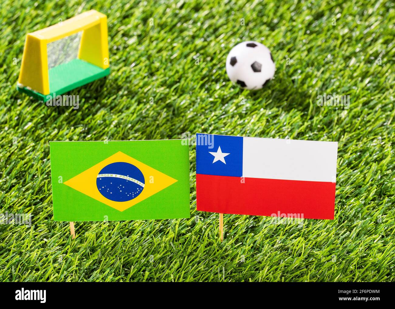 Flag of Brazil and Chile in the football stadium - Cup America football match conmebol Brazil 2019. Stock Photo