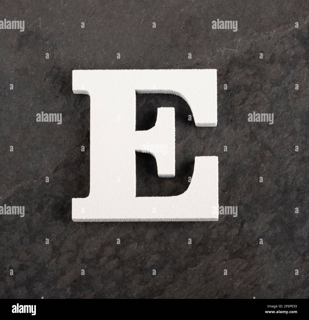 Letter E from blank alphabet on gray background Stock Photo - Alamy