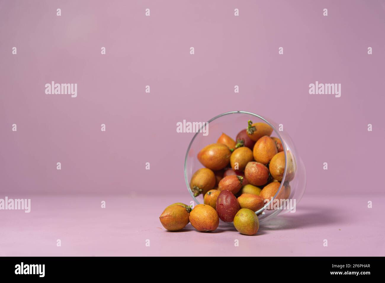 Caferana fruits (Bunchosia armeniaca) in natura served in a bowl on a pink  background. Native plant from Brazil. Fruits of medicinal trees, Exotic fru  Stock Photo - Alamy