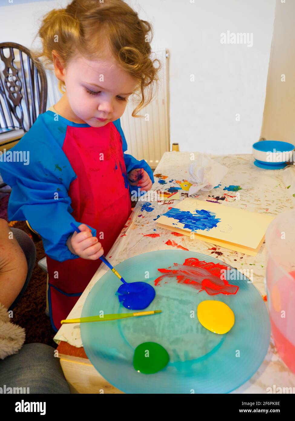 Toddler painting, UK Stock Photo