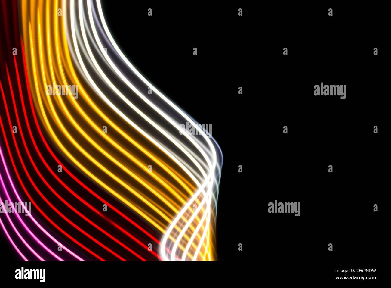 Yellow, red and pink light curve lines on a black background Stock ...