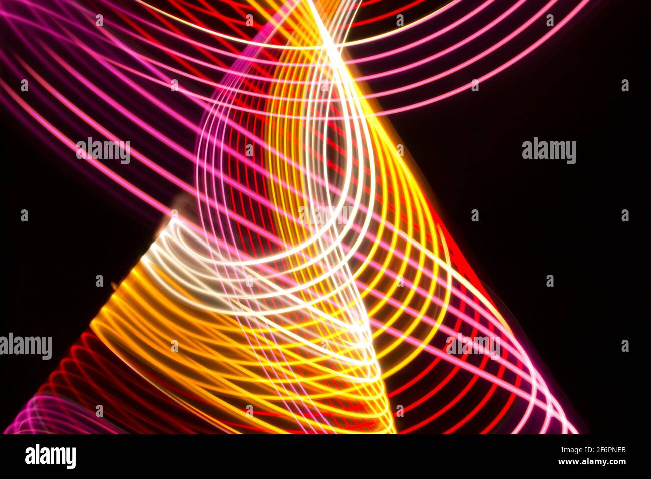 Yellow, red and pink light curve lines on a black background Stock ...