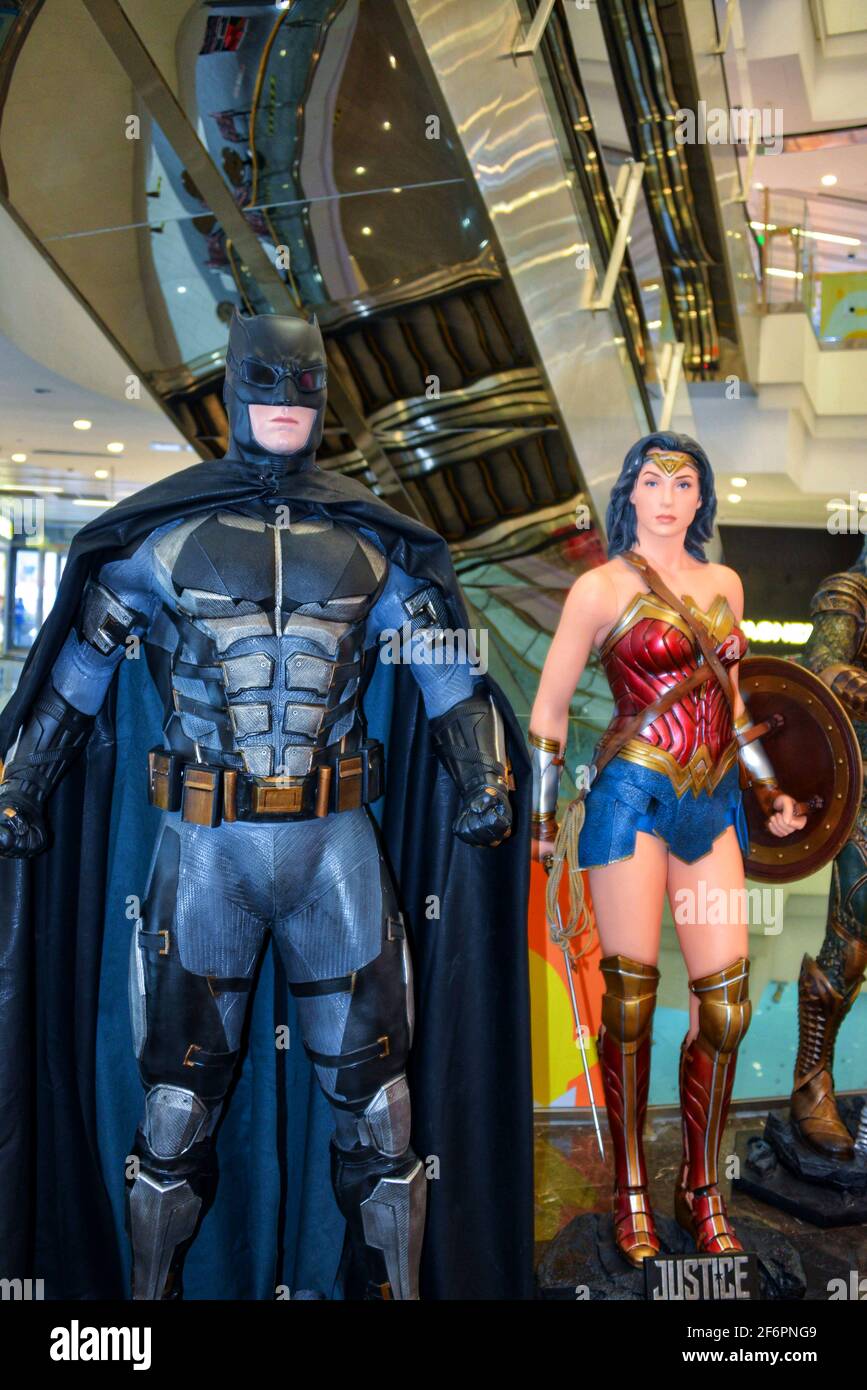 Beijing, China - November 10, 2017:  Statues of characters Batman and Wonder Woman in Justice League movie on display in mall in Beijing. Stock Photo