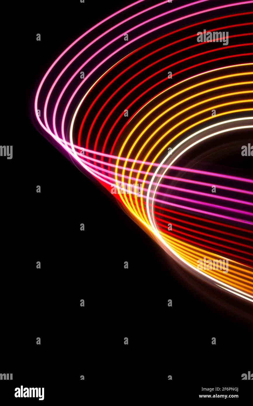 Yellow, red and pink light curve lines on a black background Stock ...