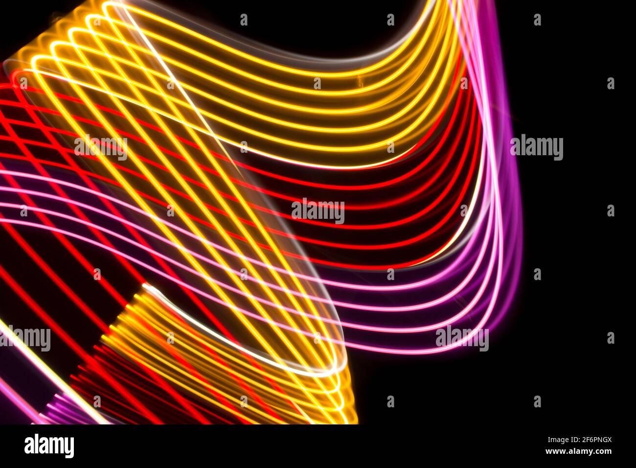 Yellow, red and pink light curve lines on a black background Stock ...