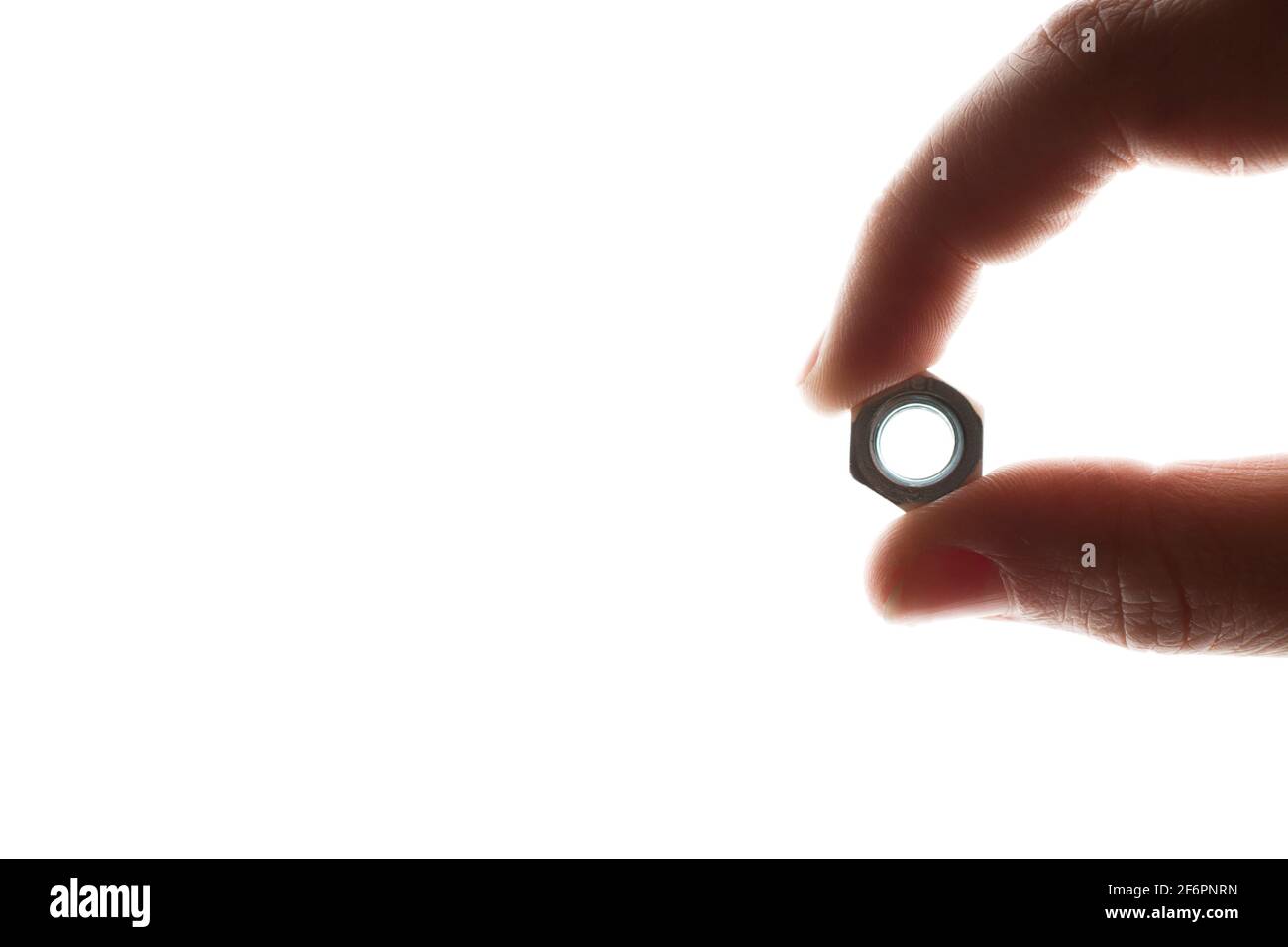 screw-nut in hands on a white background Stock Photo