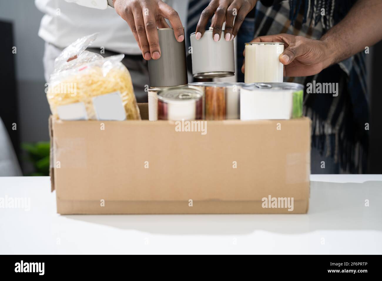 Food Drive Bank. Donating Tin Can Box Stock Photo
