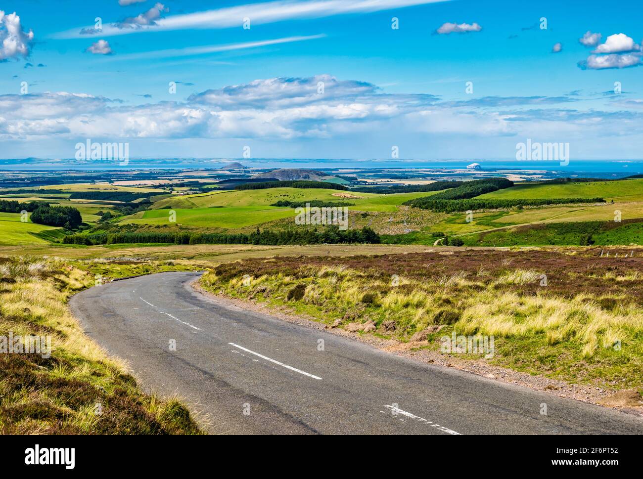Distant scenic view over moorland on quiet country road, Lammermuir Hills, East Lothian, Scotland, UK Stock Photo