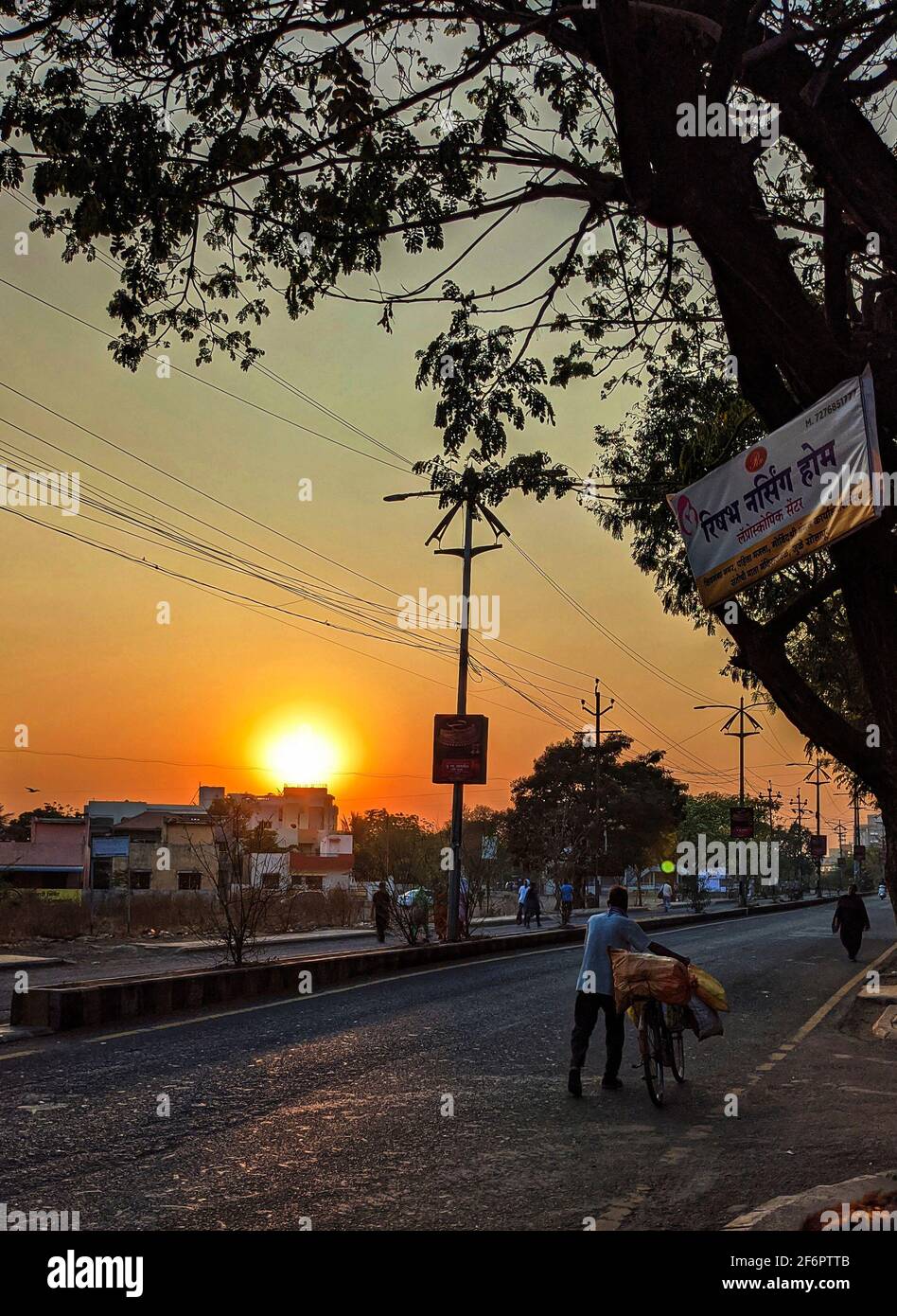 Morning sunrise in street busy peoples, Solapur, Maharashtra, India-March 14.2021 Stock Photo