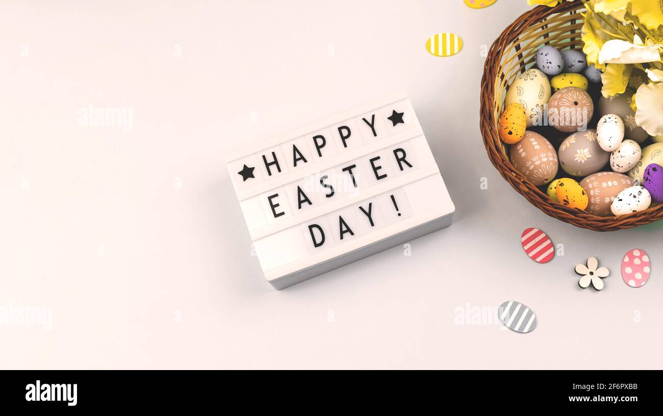 Happy Easter flat lay background with text, easter eggs, banner on a white background Stock Photo