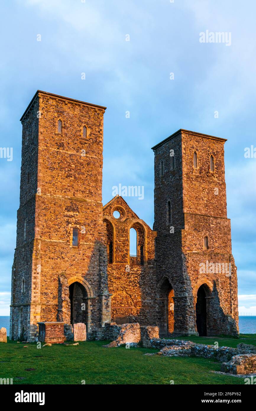 The 12th century twin towers, well known landmark on the Kent Coast, part of the ruined Angelo Saxon church at Reculver. Golden hour, early morning. Stock Photo