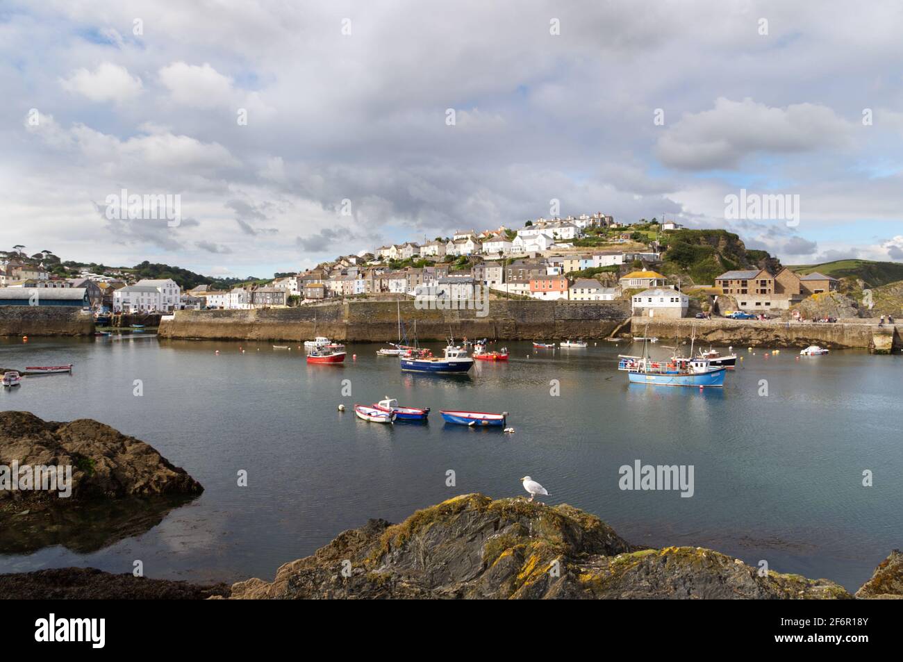Mevagissey is a village, fishing port and civil parish in Cornwall, England, United Kingdom. The village is situated approximately five miles south of Stock Photo