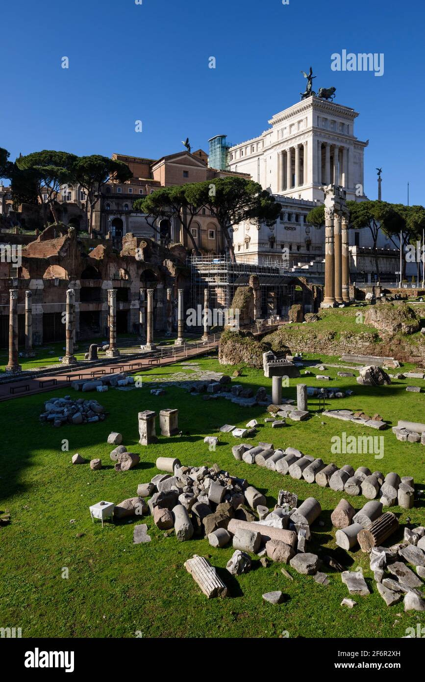 Rome. Italy. Forum of Caesar (Foro di Cesare), remains of the Temple of Venus Genetrix, the columns to the left are of the portico of the Basilica Arg Stock Photo