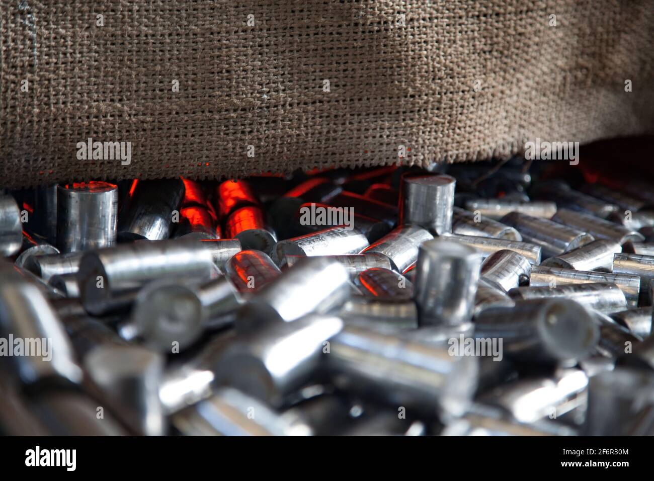 Bearing production plant. Metal  rolls annealing or heat treatment (thermohardening) in special furnace. Abstract industrial background. Kazakhstan. Stock Photo