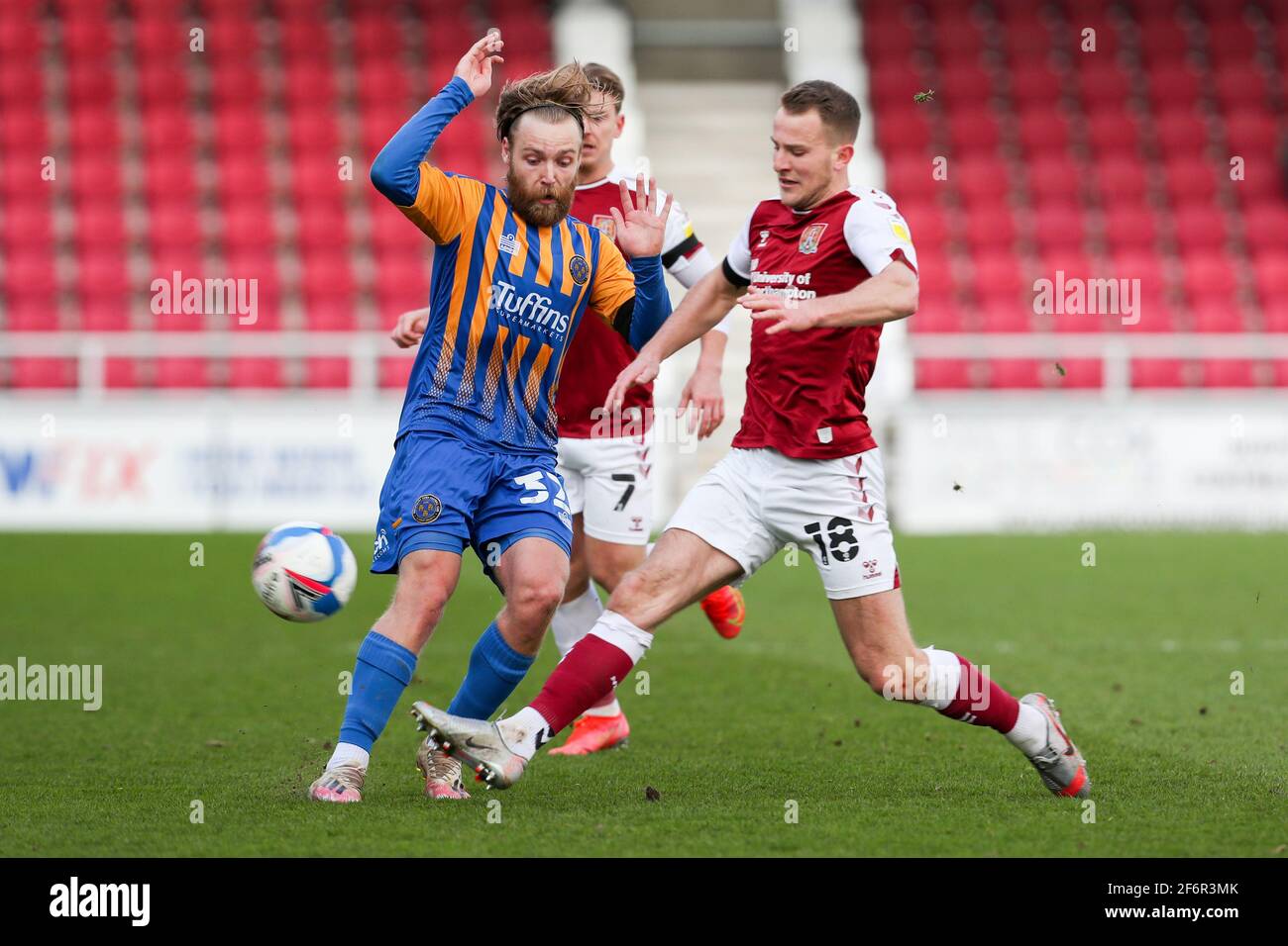 NORTHAMPTON, ENGLAND. APRIL 2ND: Shrewsbury Town's Harry Chapman is tackled by Northampton Town's Bryn Morris during the second half of the Sky Bet League One match between Northampton Town and Shrewsbury Town at the PTS Academy Stadium, Northampton on Friday 2nd April 2021. (Credit: John Cripps | MI News) Credit: MI News & Sport /Alamy Live News Stock Photo