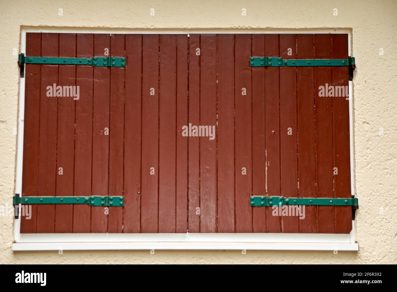 Window of a house closed with wooden shutters Stock Photo - Alamy
