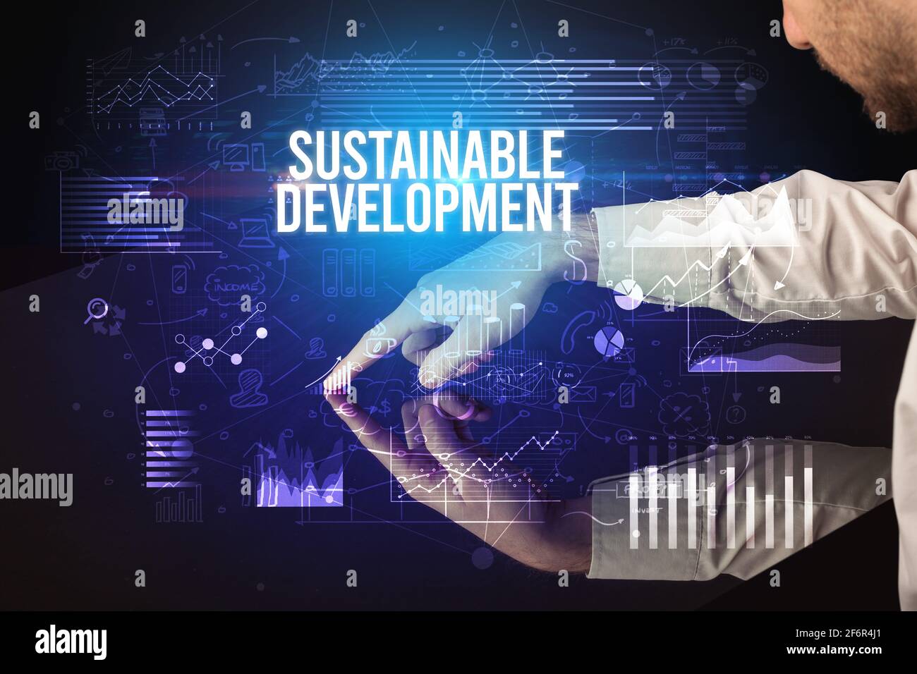 Businessman touching huge screen concept Stock Photo