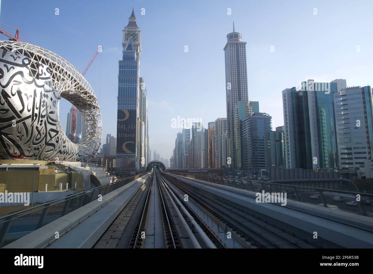 DUBAI, UNITED ARAB EMIRATES - JUN 19, 2019: Metro subway tracks of Dubai Metro along Sheikh Zayed Road with station ahead. Stock Photo