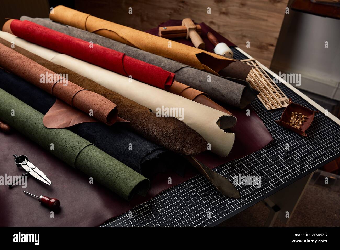 Artificial leather samples on a cow leather background. Top view Stock Photo