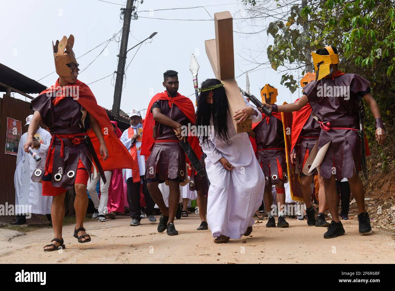 Guwahati, Assam, India. 2nd Apr, 2021. Christian devotee dressed as Jesus  Christ re-enacts the crucifixion during Eatser play on Good Friday. Jesus  Christ gave his life as a sacrifice while suffering for