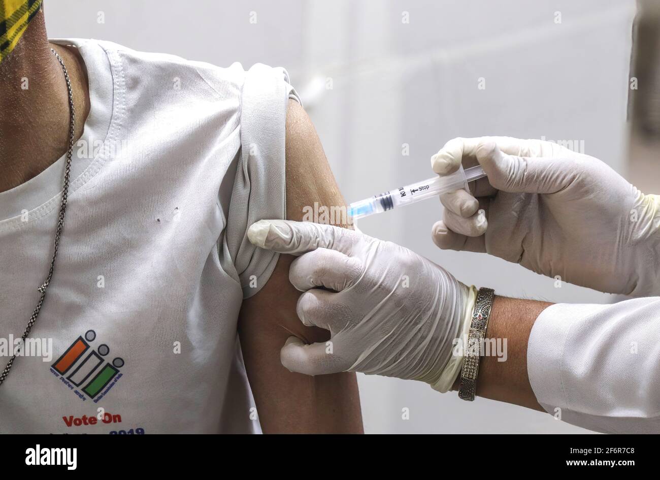 New Delhi, India. 02nd Apr, 2021. A healthcare worker administers a dose of Covishield vaccine (developed by Serum Institute) to a man during a vaccination drive at a government dispensary. India recorded 81,446 new coronavirus Covid-19 cases on 01, April 2021 and 469 deaths in 24 hours. Credit: SOPA Images Limited/Alamy Live News Stock Photo