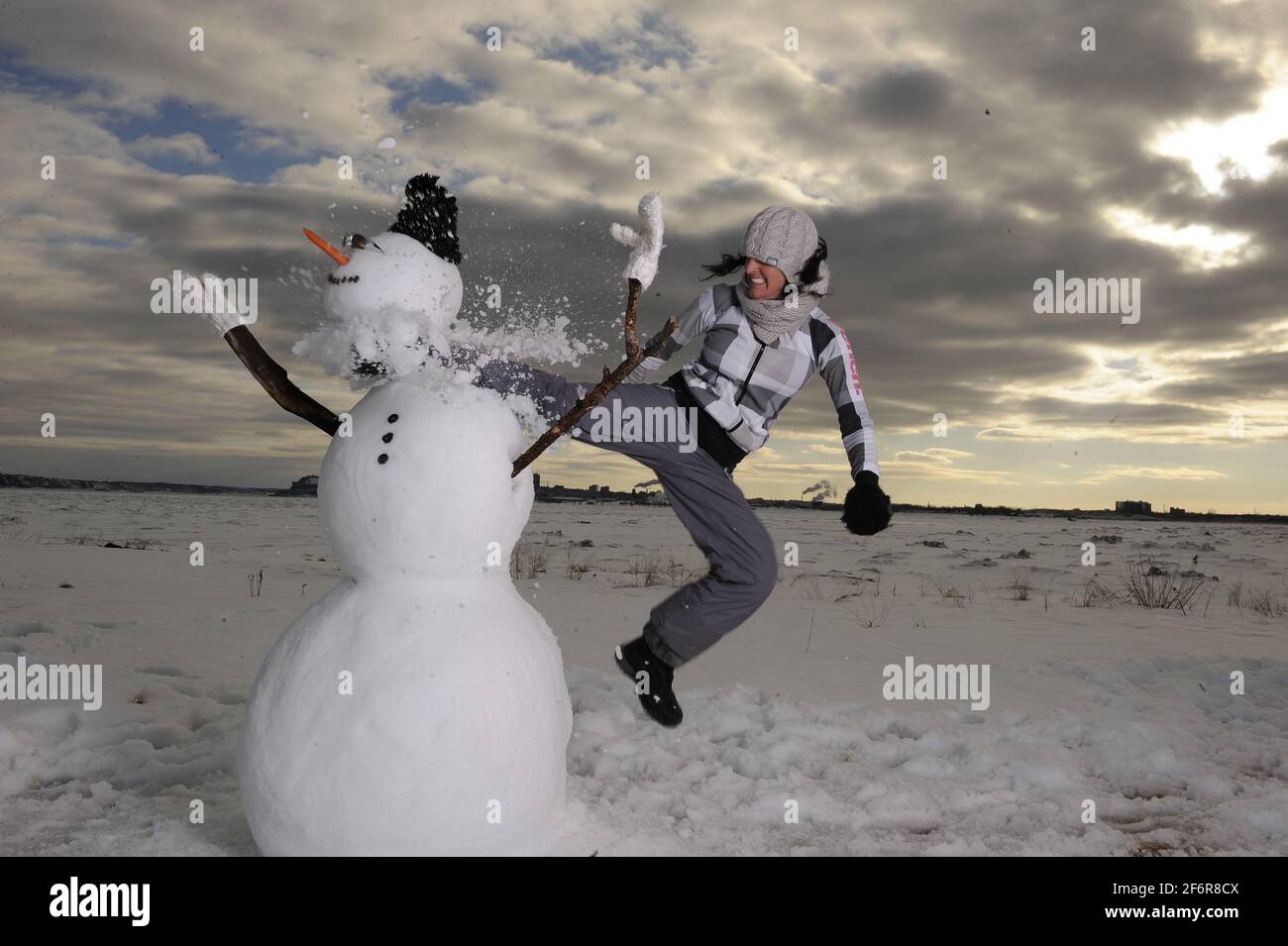 woman trash snowman Stock Photo